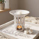 Ceramiczny kominek do wosków zapachowych OYASUMI z marmurkowym wykończeniem, kostkami wosku i świeczką tealight na dekoracyjnej tacy.